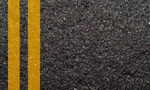 Double yellow line on asphalt texture